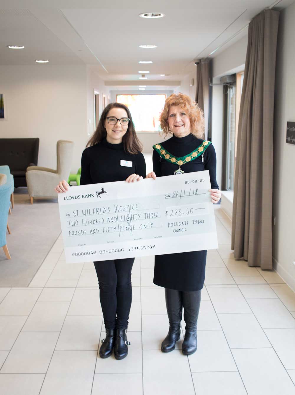 Mayor angela snell presents a very large cheque to saint wilfrids hospice