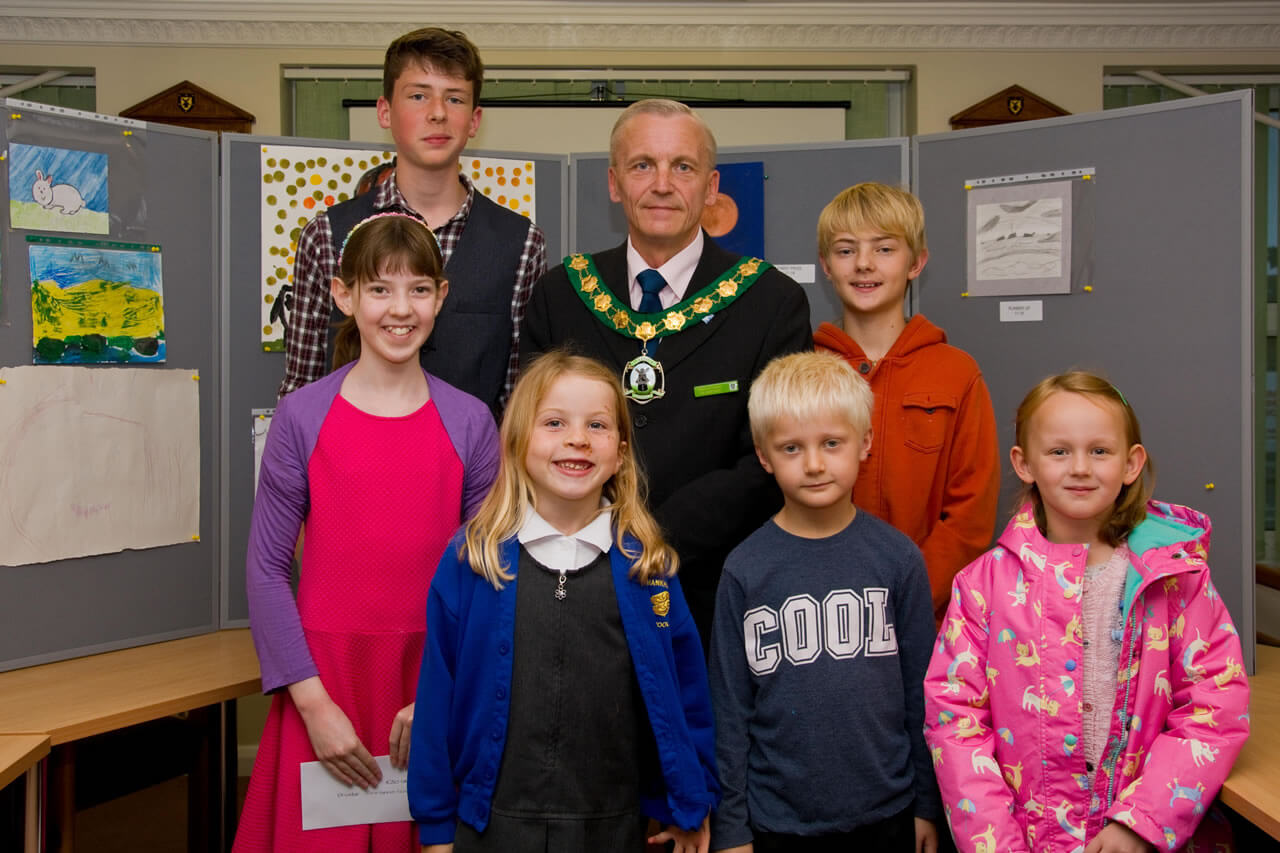 Winners of the childrens art competition gather round mayor david watts