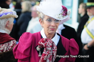 A lady in a stylish victorian hat and coat