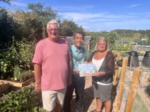 Certificate handed to allotment holders by town mayor