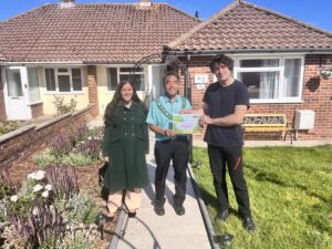 Certificate handed to residents from Town Mayor for special recognition