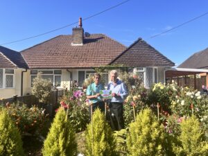 Certificate handed to residents from Town Mayor for winning the best kept garden competition