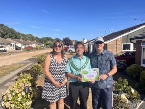 Certificate handed to residents from Town Mayor for special recognition