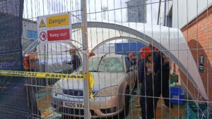 Event guests smashing a car