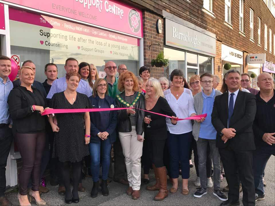 Mayor Cllr A Snell cutting the ribbon for You Raise me Up Shop