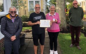 The mayor of polegate Cllr David Watts and Cllr Dan Dunbar presenting The Mayors cup award to Paul and Sandra Hayes